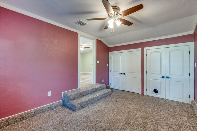 bedroom featuring carpet, ceiling fan, and lofted ceiling