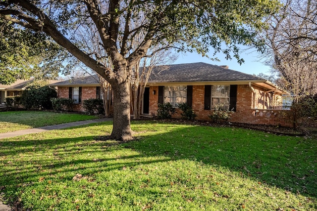 ranch-style house with a front lawn