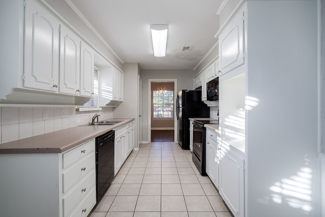 kitchen featuring black appliances, white cabinets, sink, light tile patterned floors, and tasteful backsplash