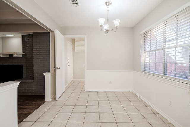 dining area featuring a notable chandelier and light tile patterned floors