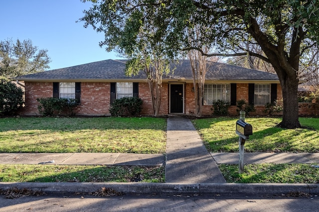 ranch-style home with a front yard