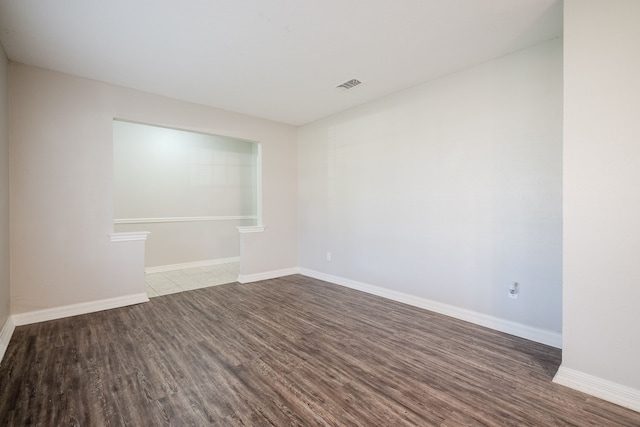 empty room with wood-type flooring