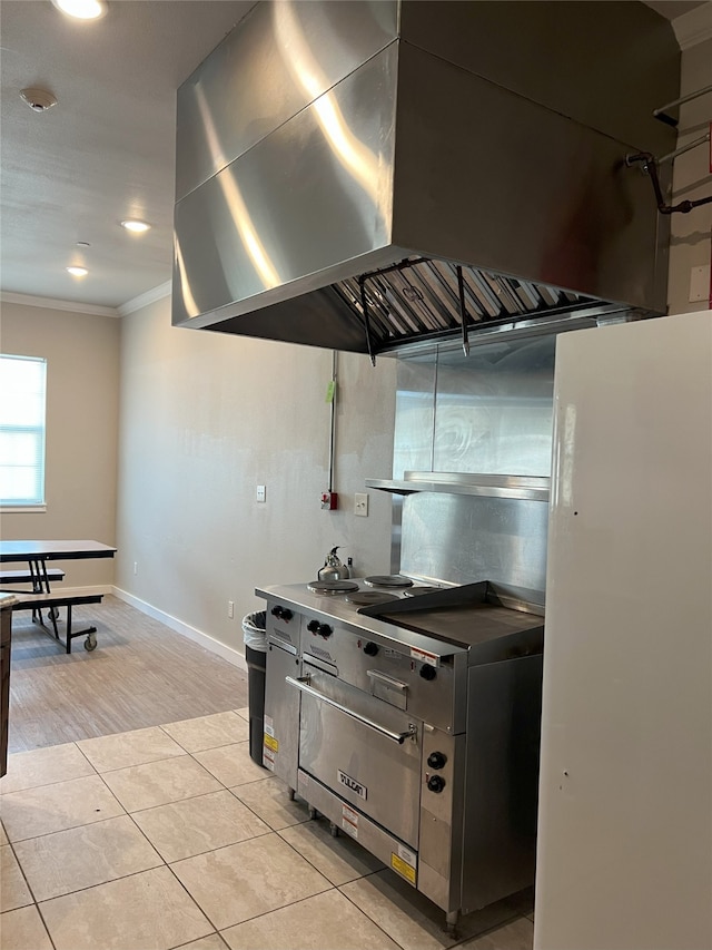 kitchen with ornamental molding, light tile patterned flooring, and decorative backsplash