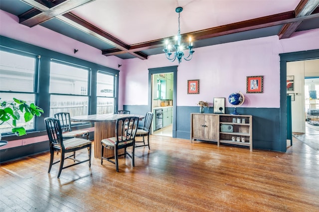 dining room with plenty of natural light, coffered ceiling, and hardwood / wood-style flooring