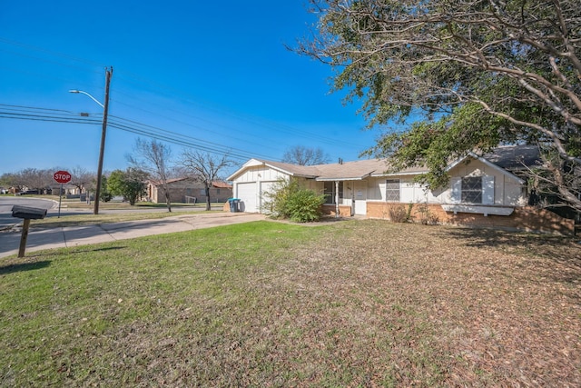 ranch-style home with a garage and a front yard