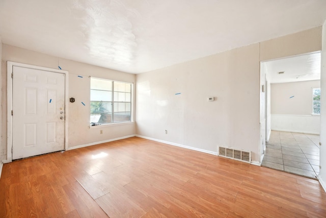 entryway with light hardwood / wood-style floors