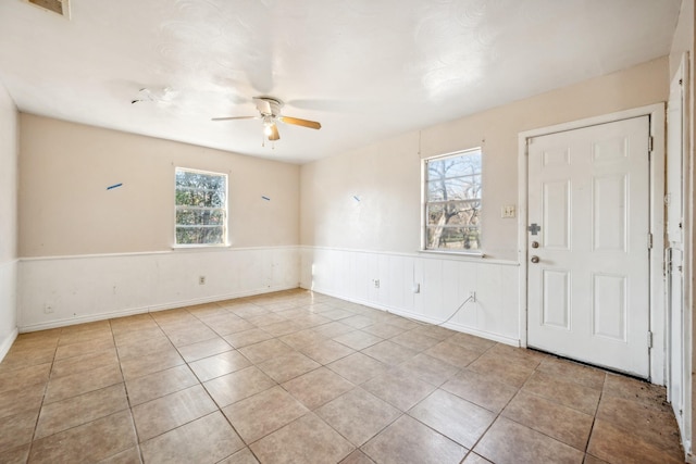 tiled entrance foyer with ceiling fan