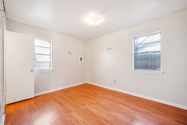 empty room featuring light hardwood / wood-style floors and a healthy amount of sunlight