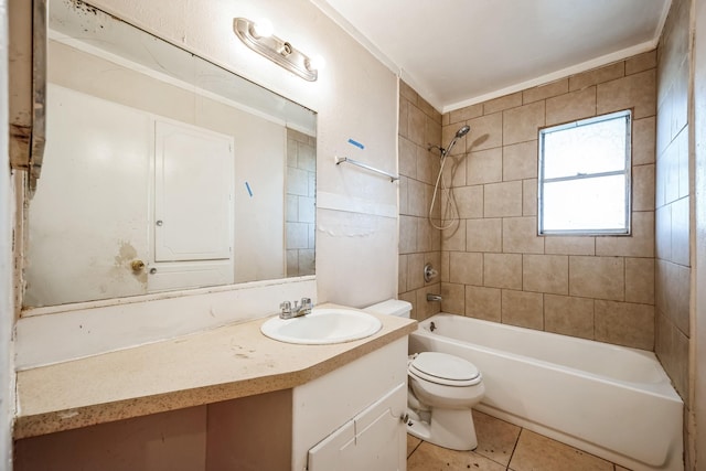 full bathroom with tile patterned flooring, tiled shower / bath combo, toilet, and vanity