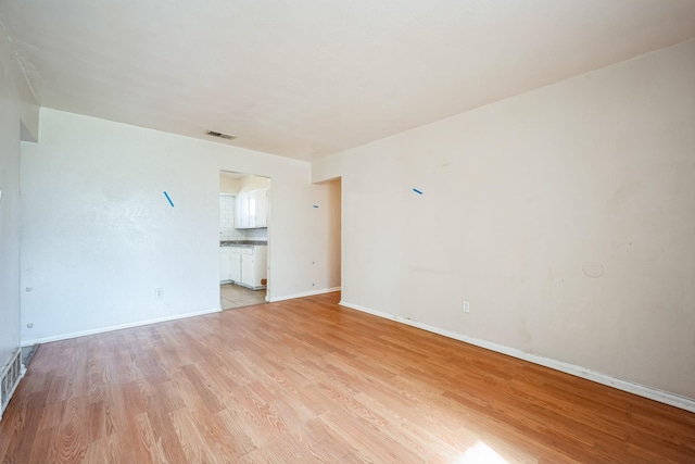 unfurnished living room featuring light wood-type flooring