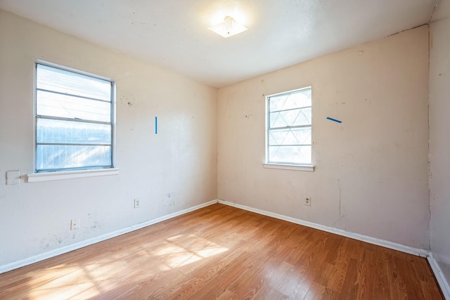 spare room with light hardwood / wood-style floors