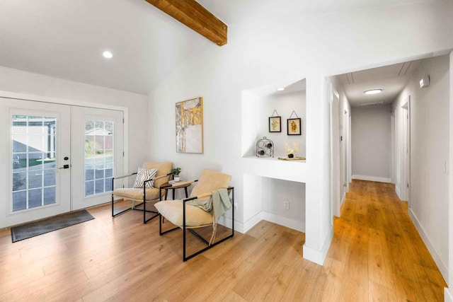 sitting room with vaulted ceiling with beams, recessed lighting, baseboards, french doors, and light wood-type flooring