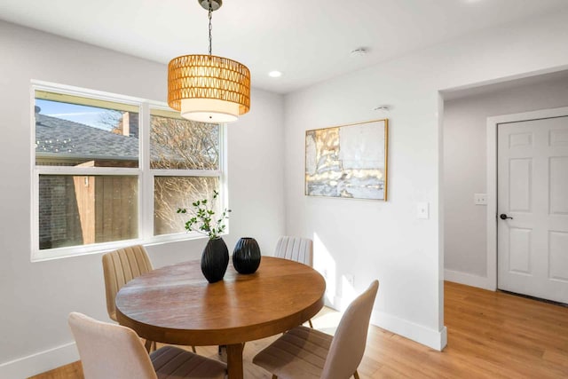 dining space with light wood-style floors, baseboards, and recessed lighting