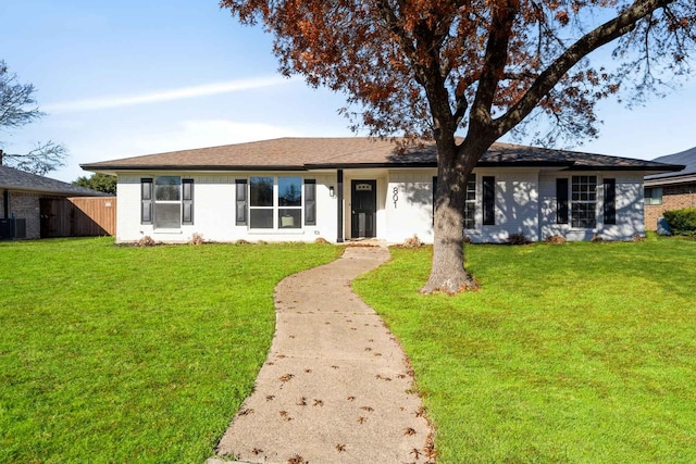 single story home featuring central AC unit, a front yard, and fence