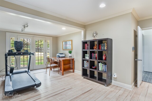 office space with crown molding, french doors, and light hardwood / wood-style floors