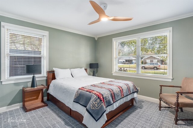 bedroom featuring carpet floors, ceiling fan, and ornamental molding