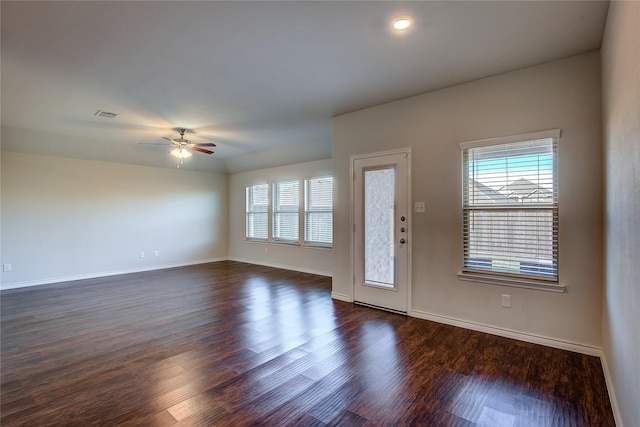 interior space with ceiling fan and dark hardwood / wood-style floors