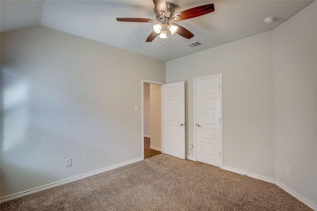 unfurnished bedroom with carpet floors, ceiling fan, and lofted ceiling