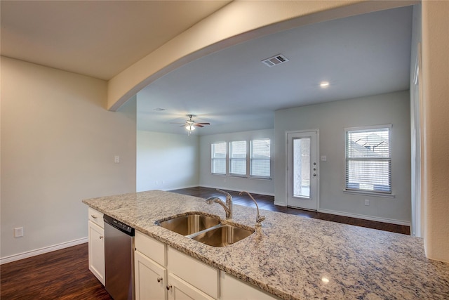 kitchen with white cabinetry, light stone countertops, sink, ceiling fan, and stainless steel dishwasher