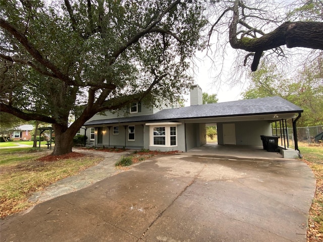 view of front facade with a carport