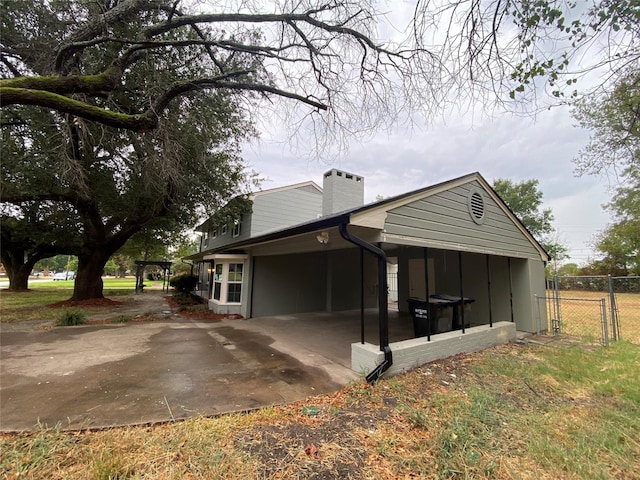 view of home's exterior with a carport