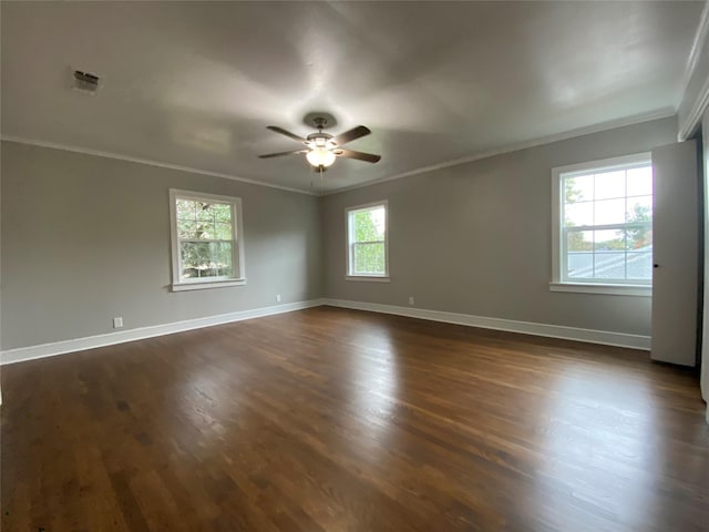 unfurnished room with dark wood-type flooring, ceiling fan, and ornamental molding