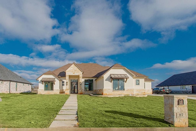 view of front of house with a front lawn