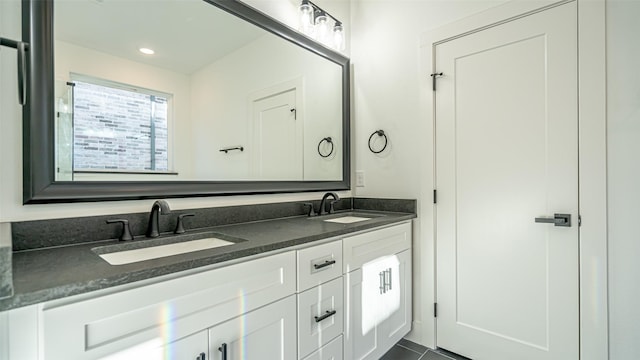 bathroom with vanity and tile patterned floors