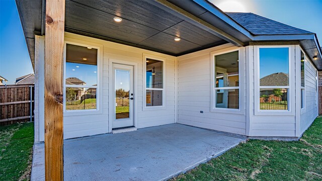 entrance to property featuring a patio