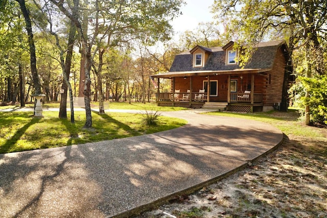 exterior space with a lawn and a porch