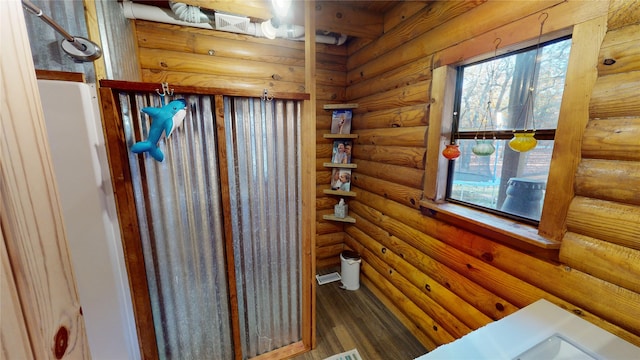 bathroom with log walls