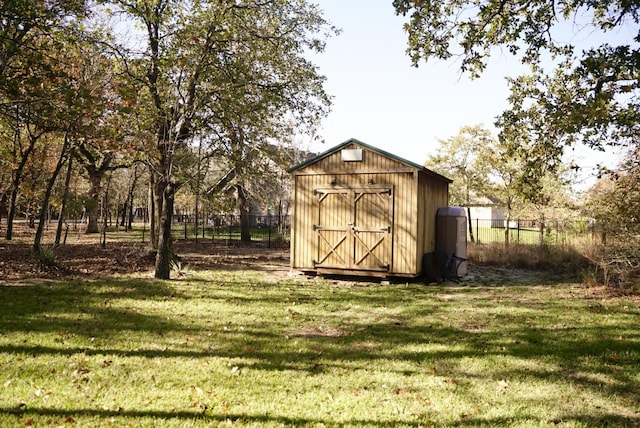 view of outdoor structure with a lawn