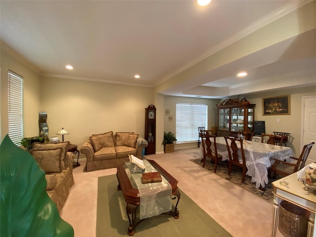 carpeted living room featuring crown molding