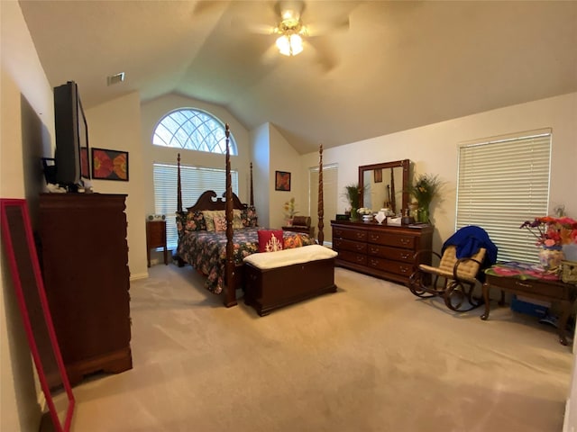 bedroom featuring ceiling fan, lofted ceiling, and light carpet