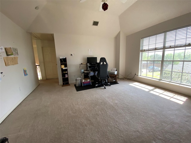 interior space featuring light colored carpet and lofted ceiling