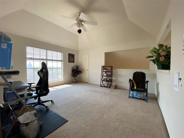 office space with carpet, a textured ceiling, ceiling fan, and lofted ceiling