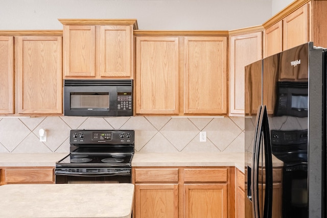 kitchen featuring decorative backsplash, light brown cabinetry, and black appliances