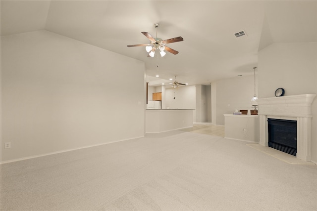 unfurnished living room with ceiling fan, light carpet, and lofted ceiling