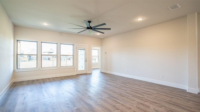 unfurnished room featuring ceiling fan and hardwood / wood-style floors