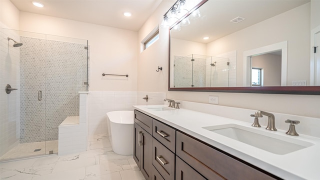 bathroom with plus walk in shower and vanity