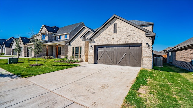 view of front of home with a garage and a front lawn