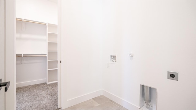 clothes washing area with hookup for an electric dryer, hookup for a gas dryer, light colored carpet, and hookup for a washing machine