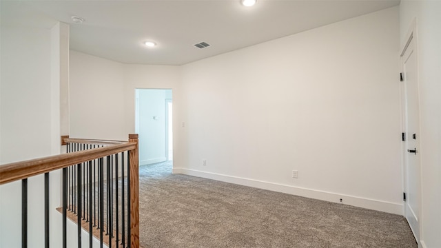 empty room featuring carpet flooring