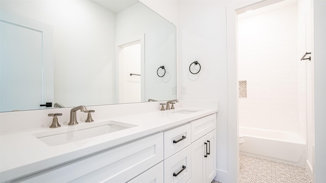 full bathroom with tile patterned flooring, vanity,  shower combination, and toilet