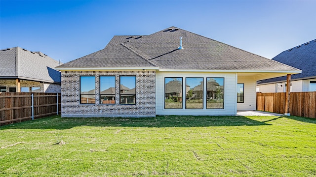 back of house featuring a yard