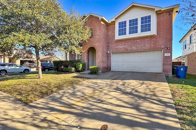 view of front of home featuring a garage and a front yard