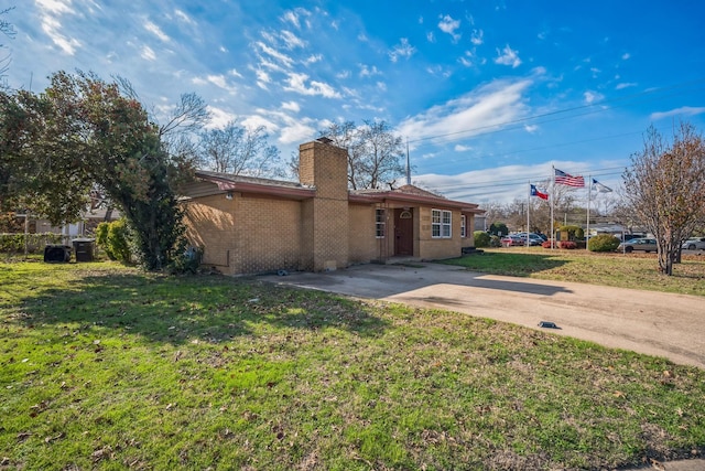 exterior space with a front yard