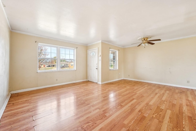 spare room featuring ceiling fan, crown molding, and light hardwood / wood-style flooring