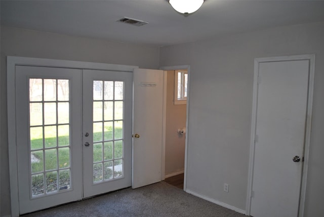 doorway with french doors and carpet floors