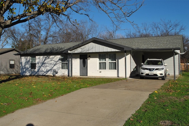 single story home featuring a carport and a front yard